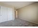 Comfortable bedroom with carpet flooring and a closet, ideal for relaxation and storage at 4275 E Amarillo Dr, San Tan Valley, AZ 85140