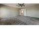 Bedroom featuring plush neutral carpet, ceiling fan, and views to the loft at 4275 E Amarillo Dr, San Tan Valley, AZ 85140