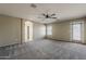 Large bedroom with neutral carpet, ceiling fan, and access to a full bath at 4275 E Amarillo Dr, San Tan Valley, AZ 85140