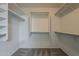 Spacious walk-in closet with built-in shelving and ample storage for an organized wardrobe at 4275 E Amarillo Dr, San Tan Valley, AZ 85140