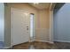 Bright entryway with tile floors, adjacent to a sidelight window, a white front door, and neutral colored walls at 4275 E Amarillo Dr, San Tan Valley, AZ 85140