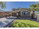 Inviting two-story home featuring desert landscaping, a two car garage, and covered parking at 4275 E Amarillo Dr, San Tan Valley, AZ 85140