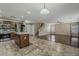 Open concept with hardwood floors, kitchen island and stainless steel appliances at 4275 E Amarillo Dr, San Tan Valley, AZ 85140