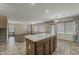 Kitchen island opening into a living room with tile and hardwood floors at 4275 E Amarillo Dr, San Tan Valley, AZ 85140