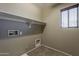 Empty laundry room featuring hookups, window, and neutral colored walls at 4275 E Amarillo Dr, San Tan Valley, AZ 85140