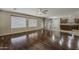 Bright living room with wood floors seamlessly connecting to the kitchen at 4275 E Amarillo Dr, San Tan Valley, AZ 85140