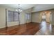 Open living room with hardwood floors, lots of natural light, and stylish curtains at 4275 E Amarillo Dr, San Tan Valley, AZ 85140