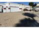 View of two attached homes with white exteriors and two-car garages at 4468 W Taro Dr, Glendale, AZ 85308