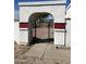 Archway gate entrance to a backyard with a gravel surface at 4468 W Taro Dr, Glendale, AZ 85308