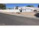 Street view of a home from across the street, showing the front yard and driveway at 4468 W Taro Dr, Glendale, AZ 85308