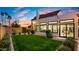 Home's backyard features a large grassy area and an updated addition at 5012 E Blanche Dr, Scottsdale, AZ 85254