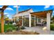 Relaxing backyard patio with pergola, string lights, and seating area at 5012 E Blanche Dr, Scottsdale, AZ 85254