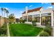 Private backyard with a grassy lawn and an updated addition at 5012 E Blanche Dr, Scottsdale, AZ 85254