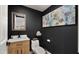 Clean and modern bathroom with wood vanity and art at 5012 E Blanche Dr, Scottsdale, AZ 85254