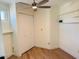 Bedroom with wood-look flooring, a closet, shelf and natural light from the window at 5012 E Blanche Dr, Scottsdale, AZ 85254