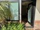 Inviting front entrance featuring a glass door and lush greenery for added curb appeal at 5012 E Blanche Dr, Scottsdale, AZ 85254