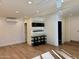 Bright living room featuring wood floors, recessed lighting, and modern wall decorations at 5012 E Blanche Dr, Scottsdale, AZ 85254