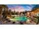 Resort style pool with a waterfall feature and rock landscaping at 5012 E Blanche Dr, Scottsdale, AZ 85254