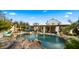 Inviting pool with rock waterfall feature and spacious patio at 5012 E Blanche Dr, Scottsdale, AZ 85254