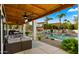 Inviting pool area with a covered patio, seating, and waterfall feature at 5012 E Blanche Dr, Scottsdale, AZ 85254