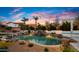 Stunning pool at sunset, surrounded by desert landscaping at 5012 E Blanche Dr, Scottsdale, AZ 85254