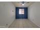 A bright bedroom with a ceiling fan and a window allowing natural light into the space at 5301 W Cambridge Ave, Phoenix, AZ 85035