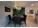 Modern dining area with a kitchen view at 5301 W Cambridge Ave, Phoenix, AZ 85035