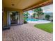 Inviting backyard featuring a refreshing pool, neat lawn, and brick-paved patio for outdoor relaxation and entertainment at 5345 E Evans Dr, Scottsdale, AZ 85254