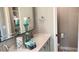Double vanity bathroom with a large mirror and decorative accents at 5345 E Evans Dr, Scottsdale, AZ 85254