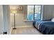 Bedroom with a large window and carpeted floor at 5345 E Evans Dr, Scottsdale, AZ 85254