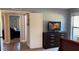 Comfortable guest bedroom with dresser and access to another bedroom at 5345 E Evans Dr, Scottsdale, AZ 85254