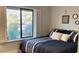 Spacious bedroom with a large window and comfortable bedding at 5345 E Evans Dr, Scottsdale, AZ 85254