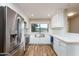 Modern kitchen with stainless steel appliances and farmhouse sink at 5345 E Evans Dr, Scottsdale, AZ 85254