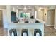 Modern kitchen with island, stainless steel appliances, and white cabinets at 5345 E Evans Dr, Scottsdale, AZ 85254