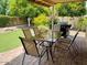 Covered patio with outdoor dining set and built-in grill at 5345 E Evans Dr, Scottsdale, AZ 85254