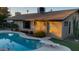 Relaxing kidney shaped pool and patio area with diving board at 5345 E Evans Dr, Scottsdale, AZ 85254