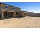 Large backyard with sand and a block wall at 5660 N 188Th Ln, Litchfield Park, AZ 85340