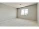 Simple bedroom with neutral walls and carpet at 5660 N 188Th Ln, Litchfield Park, AZ 85340