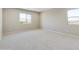 Upstairs bedroom with carpet and two windows with mountain views at 5660 N 188Th Ln, Litchfield Park, AZ 85340