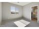 Bedroom with carpet, neutral walls, and ensuite bathroom at 5660 N 188Th Ln, Litchfield Park, AZ 85340