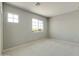 Bright bedroom featuring neutral walls and carpet at 5660 N 188Th Ln, Litchfield Park, AZ 85340