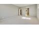 Bright bedroom with carpet and access to bathroom at 5660 N 188Th Ln, Litchfield Park, AZ 85340