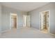 Spacious bedroom with carpet, neutral walls and closets at 5660 N 188Th Ln, Litchfield Park, AZ 85340