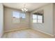 Simple dining room with light wood floors and neutral walls at 5660 N 188Th Ln, Litchfield Park, AZ 85340