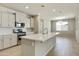 Modern kitchen with white cabinets, quartz countertops and stainless steel appliances at 5660 N 188Th Ln, Litchfield Park, AZ 85340