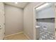 Bright laundry room with access to the hallway and a tiled floor at 5660 N 188Th Ln, Litchfield Park, AZ 85340
