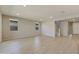 Spacious living room with light gray walls and wood-look flooring at 5660 N 188Th Ln, Litchfield Park, AZ 85340