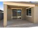 Covered patio with sliding glass doors and view of backyard at 5660 N 188Th Ln, Litchfield Park, AZ 85340