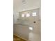 Large walk-in shower with glass enclosure and marble tile at 5660 N 188Th Ln, Litchfield Park, AZ 85340