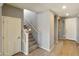 Modern staircase with gray carpeting and white railing at 5660 N 188Th Ln, Litchfield Park, AZ 85340